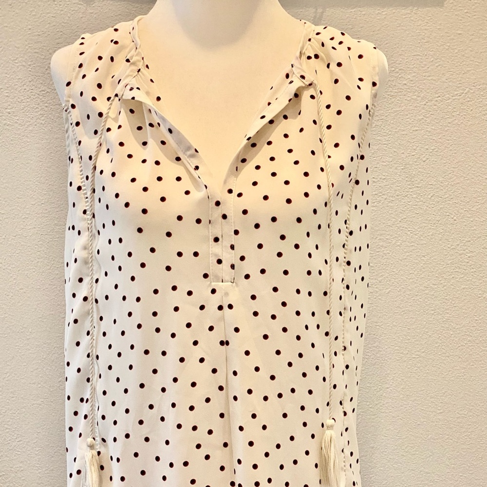White peasant style sleeveless blouse